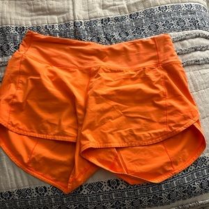 neon orange lulu shorts